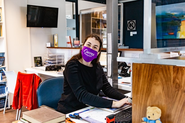 A woman employee working in her cabin